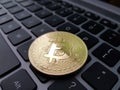Coin crypto currency bitcoin lies on the keyboard Royalty Free Stock Photo