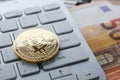 Coin crypto currency bitcoin lies on the keyboard Royalty Free Stock Photo