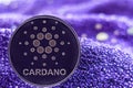 Coin cryptocurrency Cardano on modern neon background. ADA