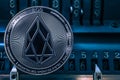 Coin cryptocurrency EOS against the numbers of the arithmometer.