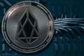 Coin cryptocurrency EOS on the background of wires and circuits. Royalty Free Stock Photo