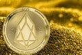 Coin cryptocurrency EOS on golden background Royalty Free Stock Photo