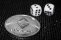 Coin cryptocurrency ethereum and rolling dice.