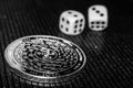 Coin cryptocurrency iota and rolling dice. Royalty Free Stock Photo
