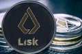 Coin cryptocurrency Lisk basic attention token on the background