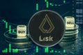 Coin cryptocurrency Lisk stack of coins and dice. Exchange chart