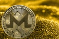 Coin cryptocurrency monero on golden background. XMR