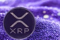 Coin cryptocurrency Ripple on modern neon background. XRP