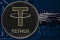 Coin cryptocurrency Tether on the background of wires and circuits. USDT.