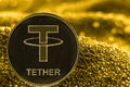 Coin cryptocurrency tether on golden background. USDT token.