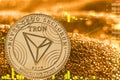 Coin cryptocurrency tron trx on golden chart.