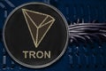 Coin cryptocurrency TRX Tron on the background of wires and circuits. Royalty Free Stock Photo