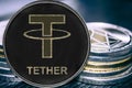 Coin cryptocurrency USDT Tether on the background of a stack of coins.