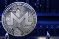 Coin cryptocurrency XMR against the numbers of the arithmometer.