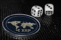 Coin cryptocurrency XRP and rolling dice.
