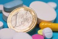 Coin of 1 euro on various tablets. The concept of the cost of drugs