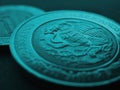 Coin 5 five Mexican pesos close-up. Peso of Mexico. Reverse of coin with coat of arms of country. Eagle and snake. Turquoise Royalty Free Stock Photo