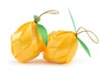 Coin folding with Ribbon is shaped a green fruit on white background for ordination scatter ceremony of buddhism. Royalty Free Stock Photo