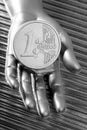 Coin of futuristic metallic silver hand