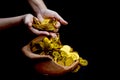 Coin gold in lady hand on lots stacking golden coins in broken jar white background, Money stack for business planning investment Royalty Free Stock Photo