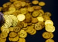 Coin gold in lady hand on lots stacking golden coins in broken jar white background, Money stack for business planning investment Royalty Free Stock Photo