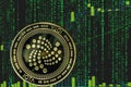 Coin iota miota cryptocurrency on the background of binary crypto matrix text and price chart.