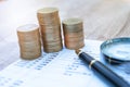 The coin ladder has a businessman. business and saving money concept. Tiny people sitting on a pile of coins Financial concepts. Royalty Free Stock Photo