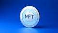Coin with the letters MFT on it Royalty Free Stock Photo