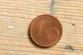 1 cent coin macro photo on wooden background Royalty Free Stock Photo