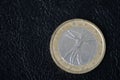 Coin in one euro on a dark background Royalty Free Stock Photo