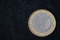 Coin in one euro on a dark background Royalty Free Stock Photo