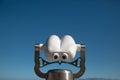 Coin operated binocular and blue background Royalty Free Stock Photo