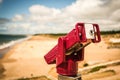 Coin-operated binocular telescope at sandy beach Royalty Free Stock Photo