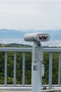 Coin Operated Binocular viewer looking out to Landscape with beautiful nature. Royalty Free Stock Photo