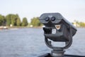 Coin operated binoculars on the edge of a river Royalty Free Stock Photo