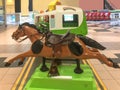 Coin Operated Childs Mechanical Horse Ride in Shopping Mall Royalty Free Stock Photo