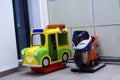 Coin operated kiddies pedal taxi and bike rides for children in door.