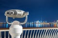 Coin operated tourist telescope mounted on a viewing platform overlooking downtown Dubai with the dominant Burj Khalifa Royalty Free Stock Photo