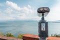 Coinoperated tourist telescope at the viewpoing on a shore of Lake Sevan in Armenia