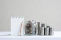 Coin piles arrange into growth chart on white background, finance and business concept Royalty Free Stock Photo