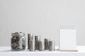 Coin piles arrange into growth chart on white background, finance and business concept Royalty Free Stock Photo