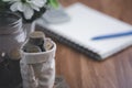 coin purse  calculator  book  and pens are all placed on the wooden table Royalty Free Stock Photo