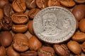 Coin of republic Ecuador on coffee beans