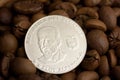 Coin of republic Ecuador on coffee beans