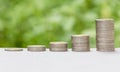Coin stack with burred bokeh background. Royalty Free Stock Photo