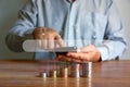 Coin stack with man using mobile phone searching looking new idea saving high return, idea saving concept Royalty Free Stock Photo