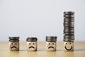 Coin stacking on smiley face and sad face for good financial planing can make happiness in life, Money saving and investment Royalty Free Stock Photo