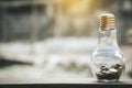 Coin stacks into bottle glass bank for step up growing business to profit and saving concept Royalty Free Stock Photo