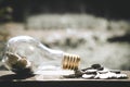 Coin stacks for step up growing business to profit and saving with bottle glass bank Royalty Free Stock Photo