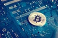 Coin symbol bitcoin on mother board Blockchain , cryptocurrencies , bitcoin and distributed ledger technology concept Royalty Free Stock Photo